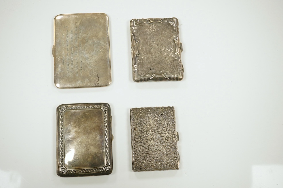 Three Edwardian and later silver note cases, gross 9.5 oz, and a sterling cigarette case with Queens Royal Regiment inscription and niello decoration, 5.5 oz. Good condition.